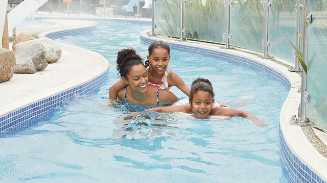 Family using outdoor pool at Haven